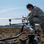 U.S. Army Sgt. Oscar Servin, a tactical unmanned aircraft system specialist, launches a Hornet, one-way strike drone, for launch in preparation for Project Flytrap at Pabradė Training Area, Lithuania, May 3, 2026. (U.S. Army Reserve photo by Sgt. Joseph Honce)